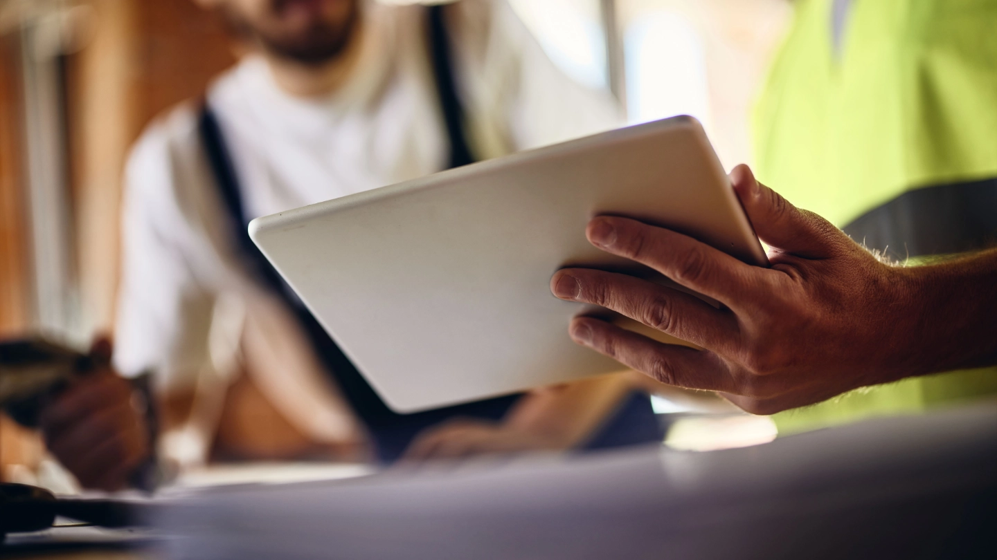 hands holding ipad image