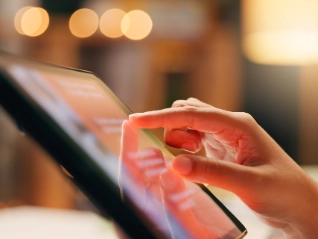 Hand touching tablet